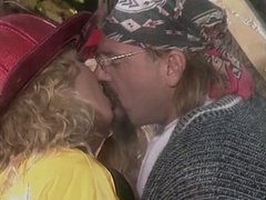 Hippy fucks two busty firefighting blondes with nice asses in field