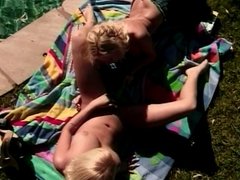 Two pretty blonde lesbian teens with big tits love to experiment by the pool