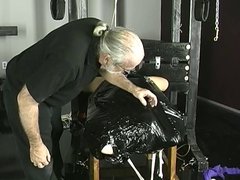 Young brunette is wrapped in black garbage bag and fucked in dungeon