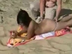 Pervert girlfriend has fun with voyeur at beach