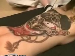 Tattooed Japanese geisha sucking cock and fucked doggy