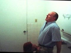 fake spy redhead gives old man head in bathroom