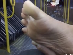Candid feet and soles on the bus