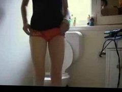 Teen masturbating to orgasm in the toilet