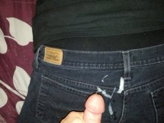 Cumshot on black jeans