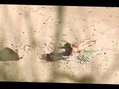 Voyeur on public beach. Hot young couple sex again