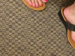 Wife's sexy feet cute and sexy shoes at the register