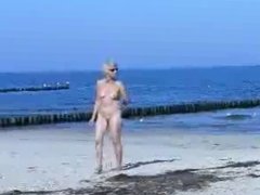 Cute hot granny fully naked at beach. Public nudity