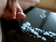 Cum on glass table