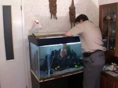 Russian Mommy seduces boy cleaner aquariums