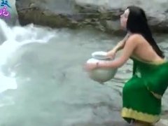 Desi girl in transparent wet saree showing boobs..hot show