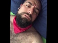 Big bearded and hairy bear wanking rubbing the bed sheet on his hard and wet cock. Beautiful Agony