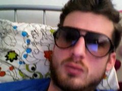 Hot European guy wanking his cock and wearing glasses