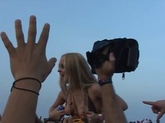 College coed takes out her tits on beach