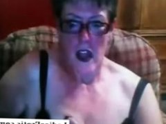 Old granny with glasses on webcam skype