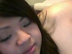 Asian girl plays with tight pussy on cam