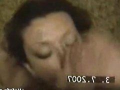 Nasty brunette sucking cock in home video