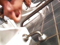 Men masturbatin in bathroom