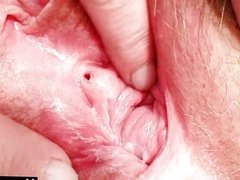 Busty old lady in uniform fingers hairy pussy