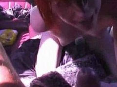 Redhead having sex in a limo