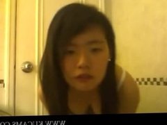 Asian chick stripping down from underwea