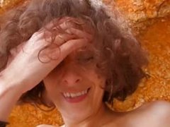 Curly-haired french brunette strips and fucks on the beach