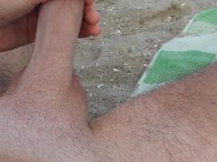 Gay guy masturbates and cum at beach in publi