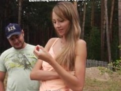 Young girl showing tits in the forest