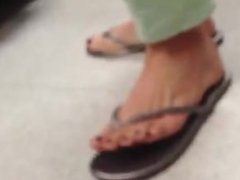 Candid Feet and Red Toes in Flip Flops