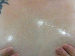 getting oiled up - playing with my boobs and massage oil