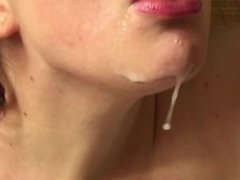Slutwife takes a shot of cum from a glass, and plays with the fuckcream