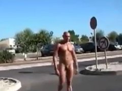 Naked bodybuilder at the parking lot