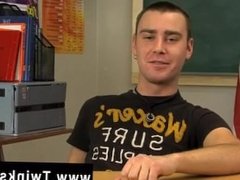 Hot gay sex Young dark haired lad Justin Giles sits at a desk in a