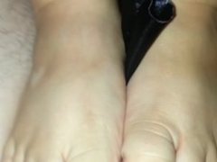 stroking my cock with her sexy toes