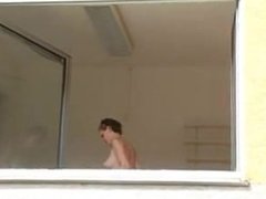 Busty german cleans window with her tits - DATES25.COM
