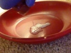 Slow-motion cumshot onto a plate