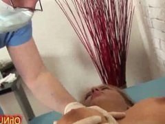 Sexy naked blonde fingered by the doctor