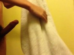 Hung twink reveals massive cock under towel