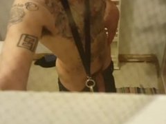 Tattooed  guy pissing