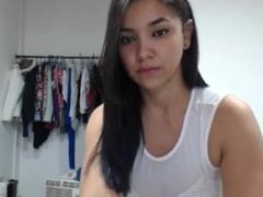 Brunette latina teasing with big ass in tight dress on LiveSpicyCams.Com