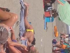 woman plays with herself on the beach