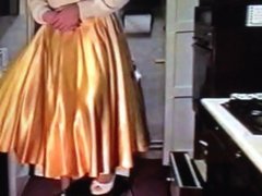 Wife in Gold Satin Skirt Dominated by Husband