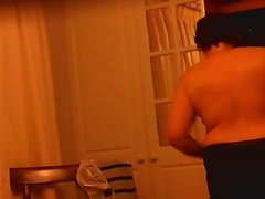 Voyeur rear view of stripping British housewife