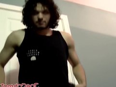 Handsome dude with curly black hair jerking off his big cock