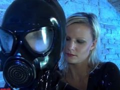 Lesbians in latex fingering and fucking with strapon in gas masks part 2