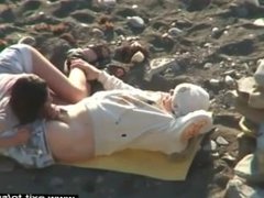 Horny amateurs on the beach secretly filmed