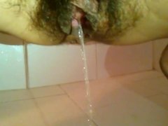 Wife with hairy pussy pissing