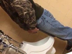 guy using the urinal