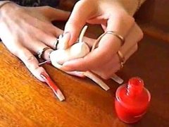 long natural nails red polishing