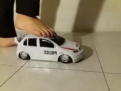 Giantess crushes a big toy car barefoot, in shoes. Totalled!